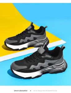 Detail of mesh and suede upper on black chunky sneakers with shock absorption sole