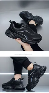 Détails des baskets noires massives avec mesh respirant et semelles épaisses amorties