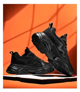 Detail view of all-black chunky dad sneakers with wave silhouette and thick lug sole