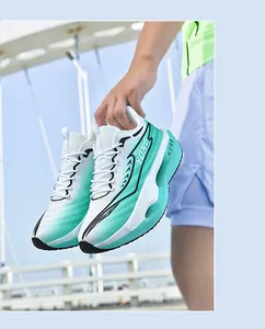 Close-up of white and mint green gradient running shoe with breathable mesh and thick sole