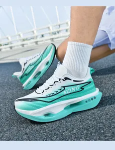 Detail of mint green running shoes with thick cushioning midsole and breathable fabric