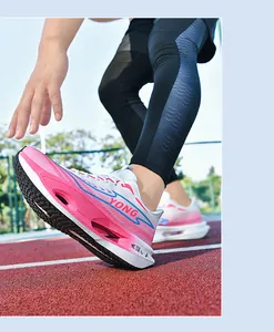 Detail of breathable pink and white running shoe with carbon plate on track
