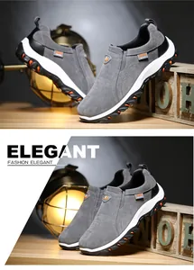 Vue détaillée de chaussures de randonnée en daim gris avec semelles crantées oranges