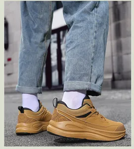 Detail of tan casual sneakers with cloud pattern on heel and thick cushioned sole