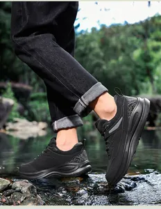 Outdoor walk showing black anti-slip hiking shoes with cloud patterns and thick soles