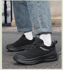 Detail of black cushioned leather casual sneakers with textured non-slip thick soles