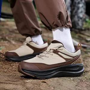 Men's outdoor hiking shoes in brown and beige featuring thick cushioning soles