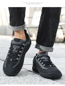 Detail of outdoor hiking shoes on feet showing breathable mesh and EVA foam sole