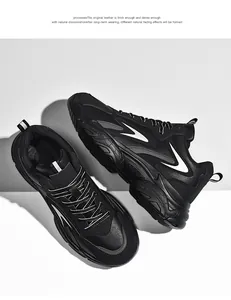 Detail of chunky platform sole and black leather texture on men's retro dad sneakers