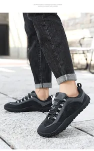 Outdoor view of lightweight black barefoot hiking shoes with EVA foam sole and lace-up design