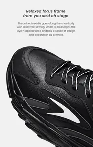 Detail of reinforced stitching and lychee pattern leather on black chunky sneakers