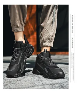 Macro street view showing black platform chunky sneakers with a thick shock-absorbing sole
