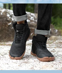 Detail of waterproof winter boots with fleece lining and non-slip rubber soles in the snow