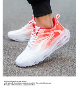 Detail shot of orange and white gradient running shoes featuring a transparent air cushion sole