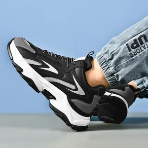 Men's chunky color-block sneakers with thick cushioning sole in black, grey, and white