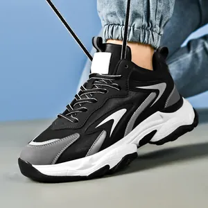 Men's chunky cushioned sneakers with black, white, and gray patchwork design for daily wear