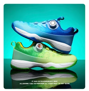 Detail of professional badminton shoes showing rotating dial lace system and wavy grip sole