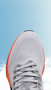 Macro view of breathable fly-knit mesh material on lightweight running shoes