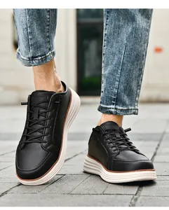 Detailed outdoor shot of black leather casual shoes with white thick soles for men