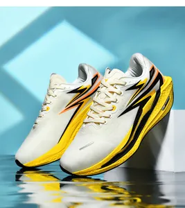 Detail of white running shoes featuring breathable mesh and vibrant neon yellow cushioning