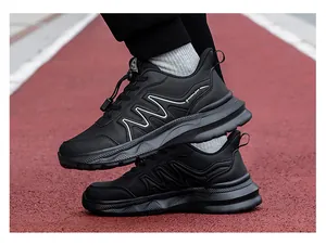 Detail of black outdoor walking shoes with quick-lace system and cushioned soles