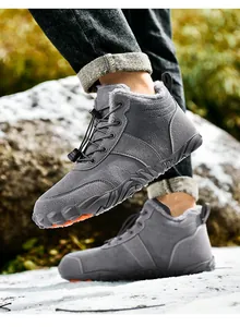 Close-up of high-top winter boots with thick grey plush lining and adjustable drawstrings
