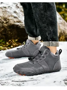 Detail of warm grey winter outdoor boot with thick faux fur lining and anti-slip sole