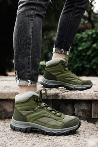 Army green high-top outdoor hiking boots with anti-slip rubber soles for winter trekking