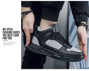Side view of men's high-top sneakers in black and grey with stylish JGAK logo detail
