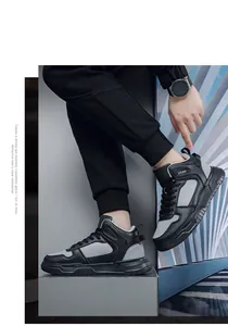Close-up of black and grey high-top sneakers showing side texture and rubber sole