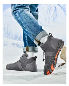 Detail view of dark grey winter snow boots with warm faux fur lining and non-slip rubber sole