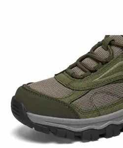 Close-up of winter hiking boot featuring anti-collision toe cap and breathable mesh