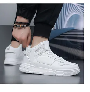 Detail view of white high-top leather sneakers with thick rubber soles and JGAK logo