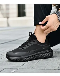 Detail of breathable mesh upper and durable thick sole on black running shoes
