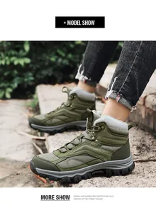 Detail of army green outdoor hiking boots featuring non-slip thick sole and metal lace hooks