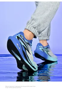 Detail of blue gradient running shoes showing shock-absorbing sole and FVIM logo