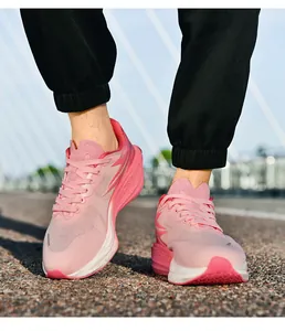 Outdoor low-angle view of pink mesh running shoes with breathable upper and thick cushioned sole