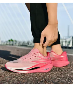 Close-up of pink running shoes with breathable mesh and thick cushioning on a bridge