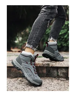Close-up of hiking boots with anti-slip rubber soles walking on outdoor stone steps