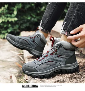 Outdoor look of high-top hiking boots with grey mesh, red accents and non-slip rubber soles