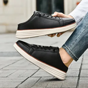 Men's black slip-on mule sneakers with thick white soles and synthetic leather finish