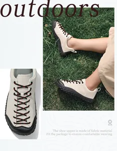 Détail de chaussures de randonnée avec embout renforcé et lacets tissés rouge et noir
