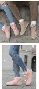 Close-up of warm faux fur lining and bungee toggle lace-up on winter snow boots