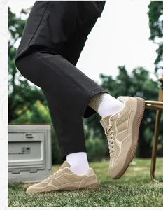 Detailed close-up of khaki suede sneakers showing durable gum rubber sole and side air holes