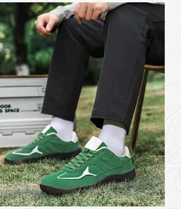 Macro detail of green suede hiking sneakers with durable thick rubber soles for outdoor use