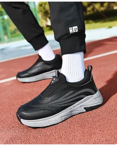 Detail of black slip-on thermal sneaker with thick grey anti-slip sole and wave pattern