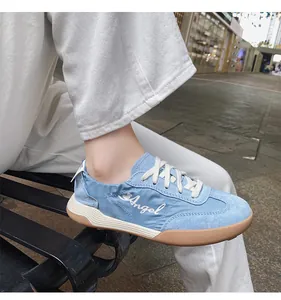 On-foot view of light blue leather casual sneakers with Angel embroidery and gum sole