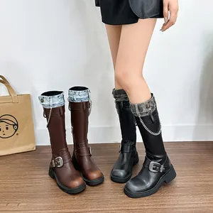 Maillard distressed cowboy boots with platform heel and denim patchwork with metal chains