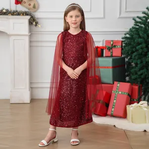 Detail of burgundy sequin girls dress with a long sheer mesh cape for Christmas