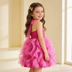 Detail of rose red sequin bodice dress with halter neck and tiered ruffle mesh skirt